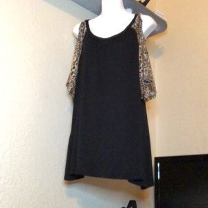 Black top with leopard print sleeves